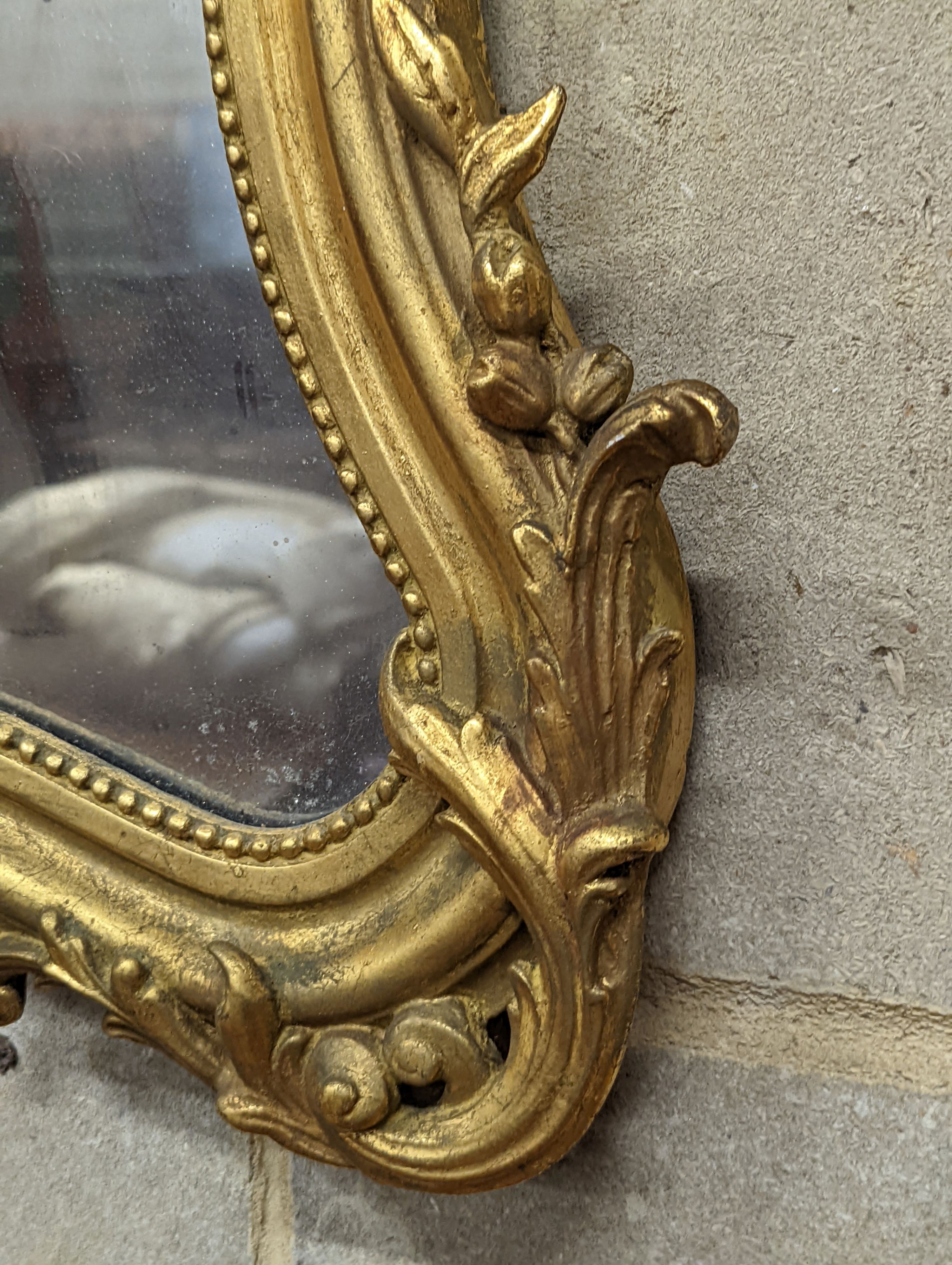 A 19th century French giltwood and gesso cartouche wall mirror, width 51cm, height 66cm